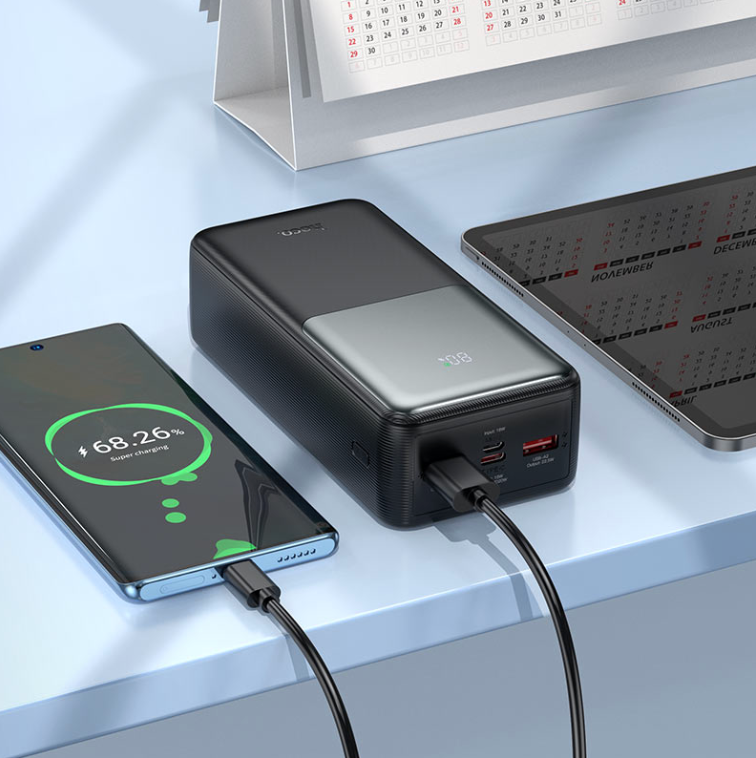 HOCO J136B 30000mAh portable power bank in black for smartphones, tablets and USB-powered devices.